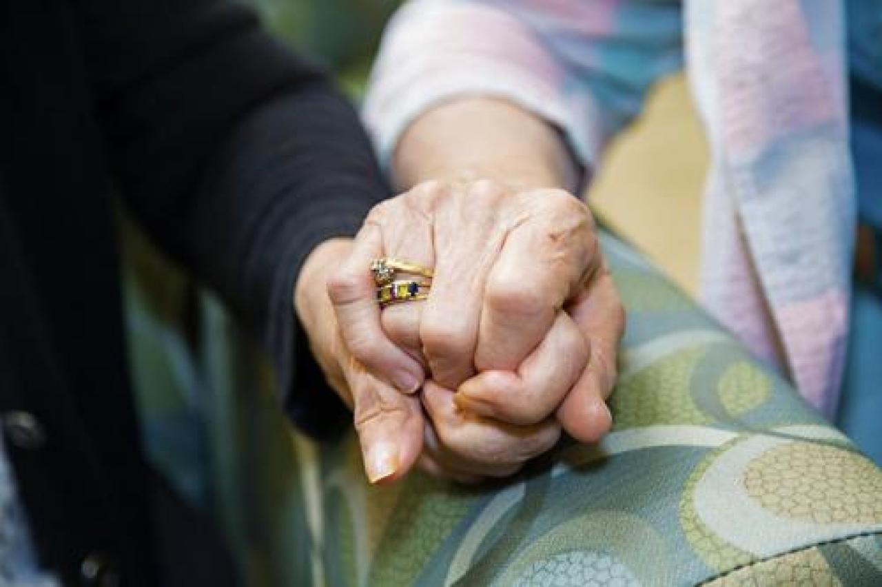 close-up of two hands clasped together 