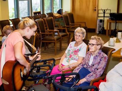 Music Therapist with 2 residents.jpg