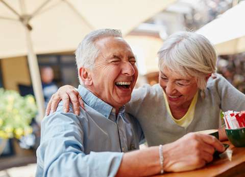 Man and Women Laughing Together 