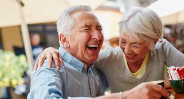 Man and Women Laughing Together 